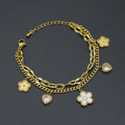 Gold Clover Heart Pendant charm bracelet with double link chain by Bestbeads&Beyond, featuring a heart and clover charms.