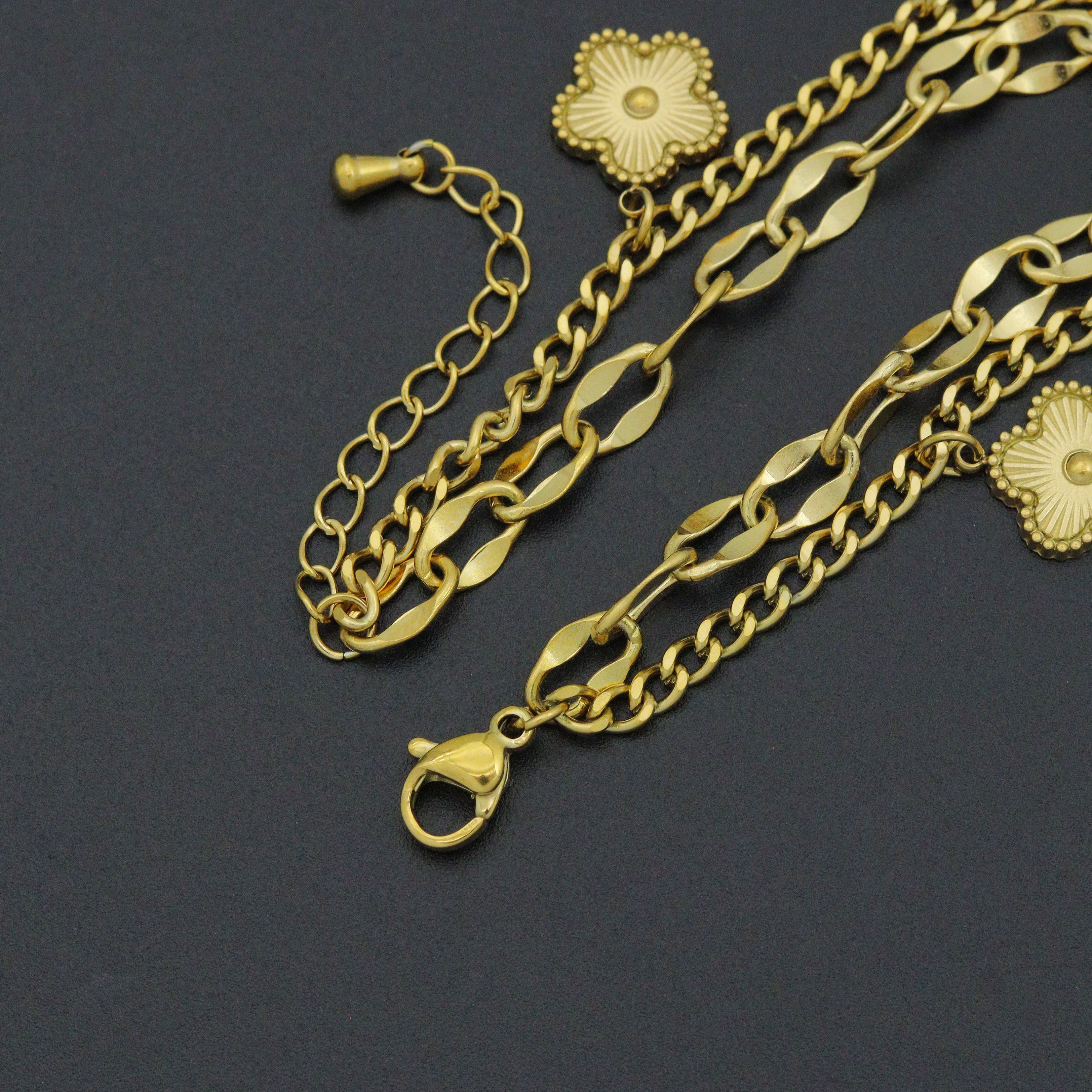Gold Clover Heart Pendant Double Link Chain Charm Bracelet by Bestbeads&Beyond, featuring a heart and clover charm on a gold chain.