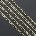 Wholesale hammered oval link chain by Bestbeads&Beyond, showing close-up of textured metal jewelry chain.