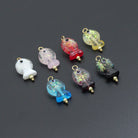 Handmade colorful glitter fish charm with evil eye design, crafted by Bestbeads&Beyond, featuring vibrant details and a lucky symbol.