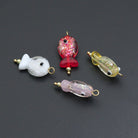Handmade colorful glitter fish charm with evil eye design, crafted by Bestbeads&Beyond, featuring vibrant hues and intricate details.