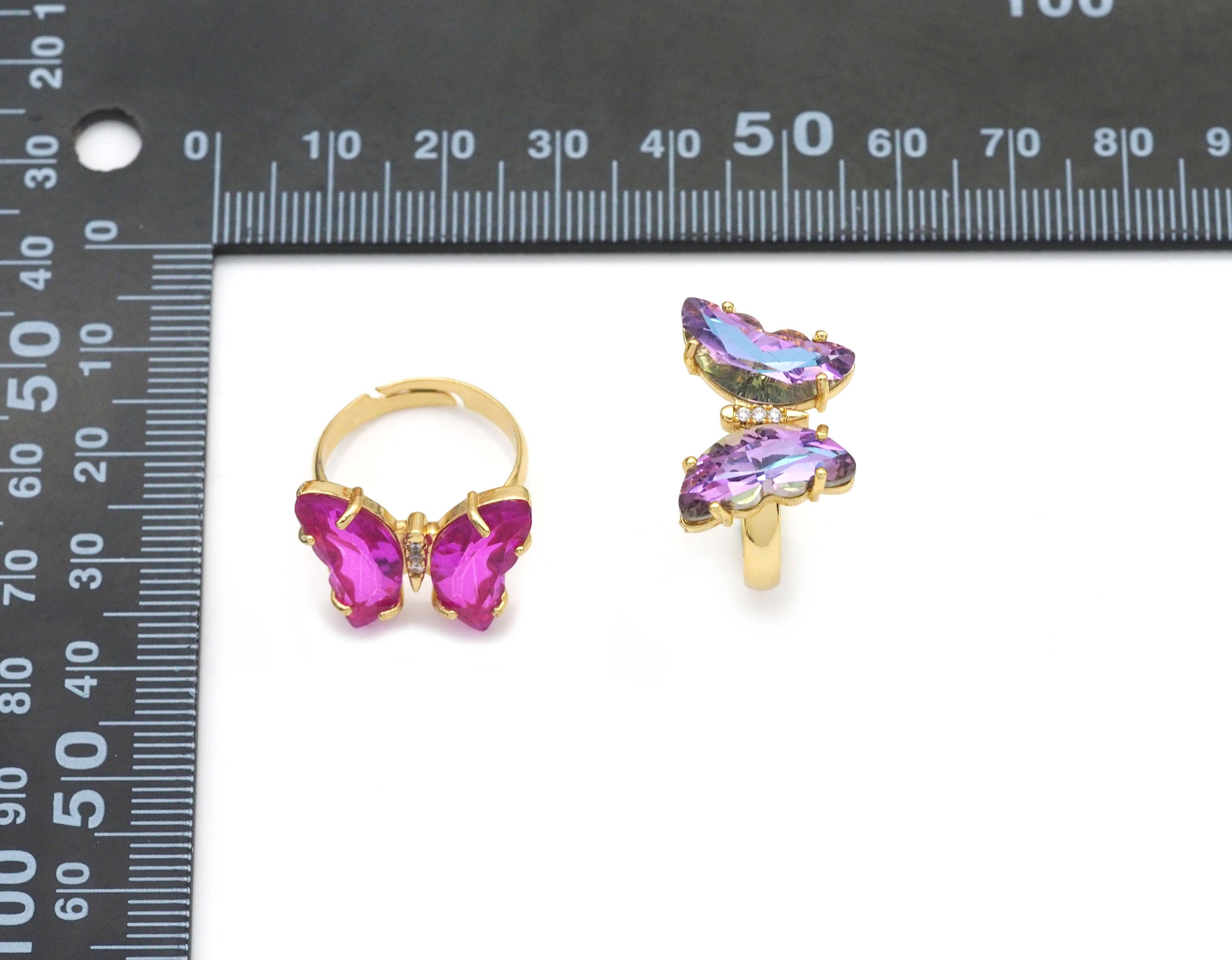 Colorful crystal butterfly adjustable cocktail ring by Bestbeads & Beyond, featuring vibrant blue crystals and intricate butterfly design.