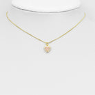 Natural pink hot pink crystal heart charm from Bestbeads & Beyond, showcasing a sparkling pendant with a detailed heart shape.