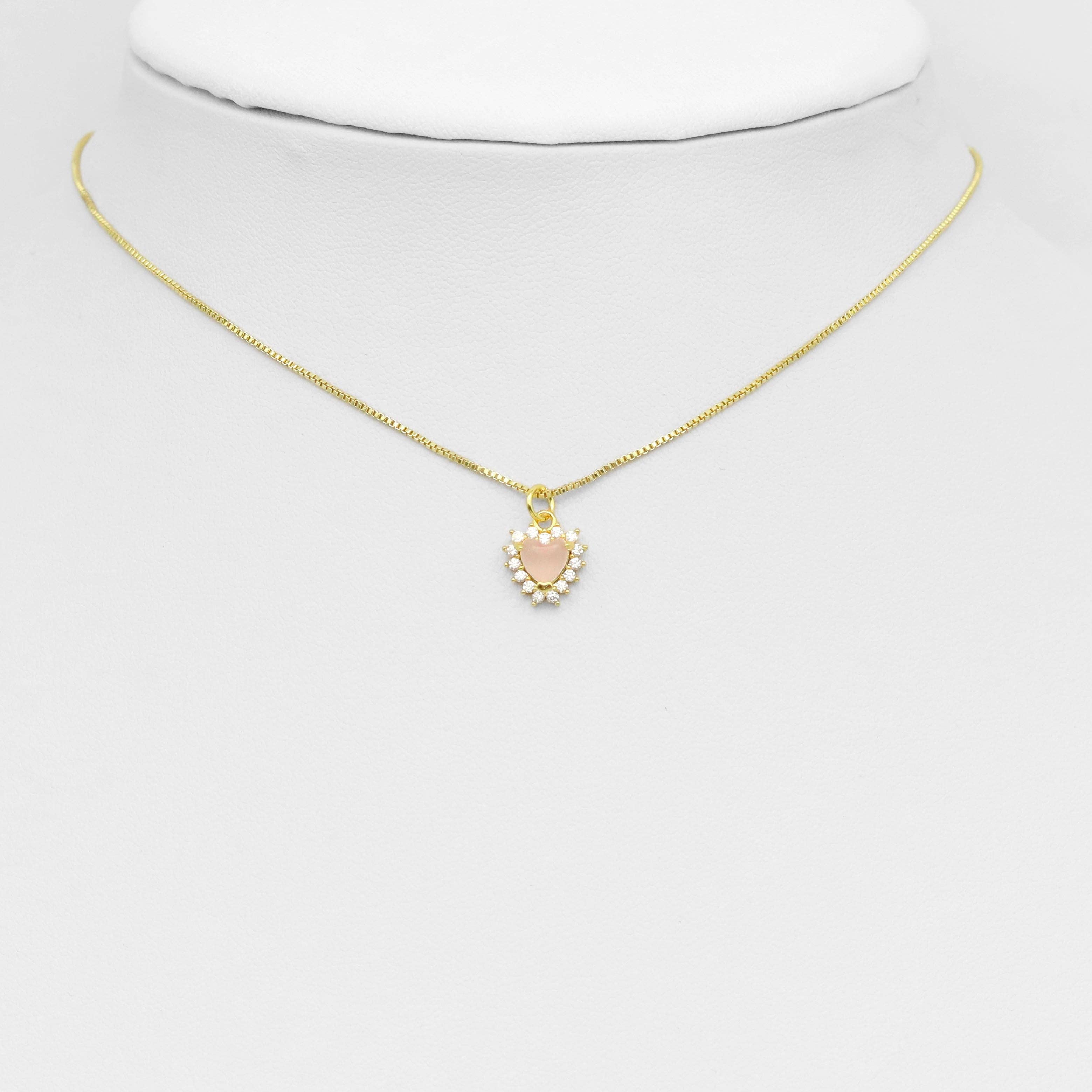 Natural pink hot pink crystal heart charm from Bestbeads & Beyond, showcasing a sparkling pendant with a detailed heart shape.