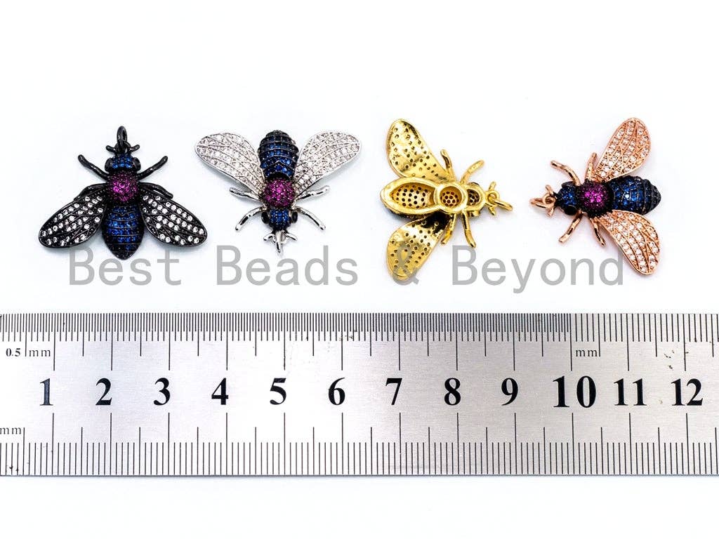 Black bee-inspired charm pendant with multicolor cubic zirconia micro pave, gold, rose gold, silver, and black finishes, 21x29x5mm.