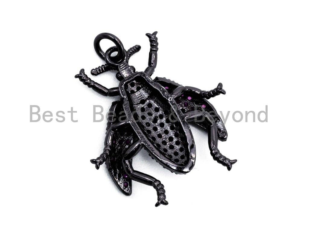 Beetle-inspired charm pendant with fuchsia cubic zirconia, available in gold, rose gold, silver, and black, 23x25mm.