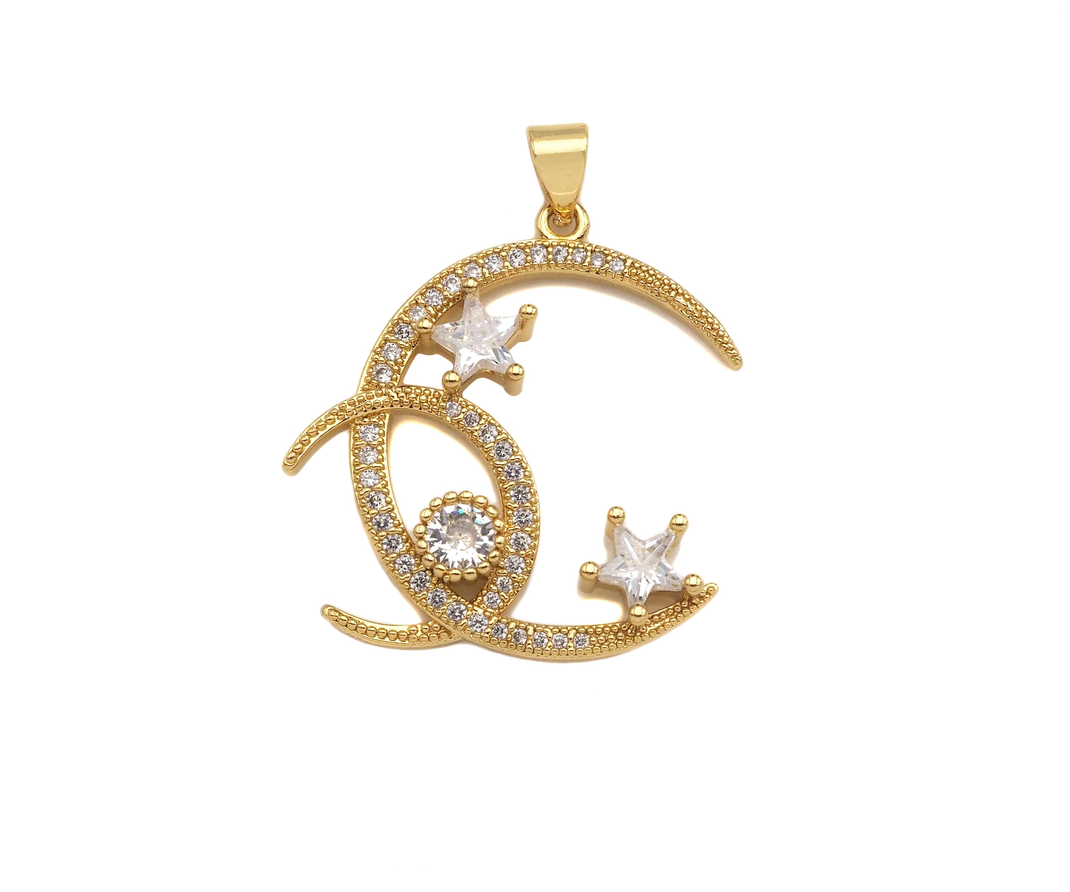 Gold CZ micro pave double crescent moon with star charm pendant, 26x28mm, perfect for necklaces or bracelets.