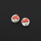 Red mushroom pendant on white pearl spacer beads, handcrafted charm from Bestbeads&Beyond, perfect for jewelry making.