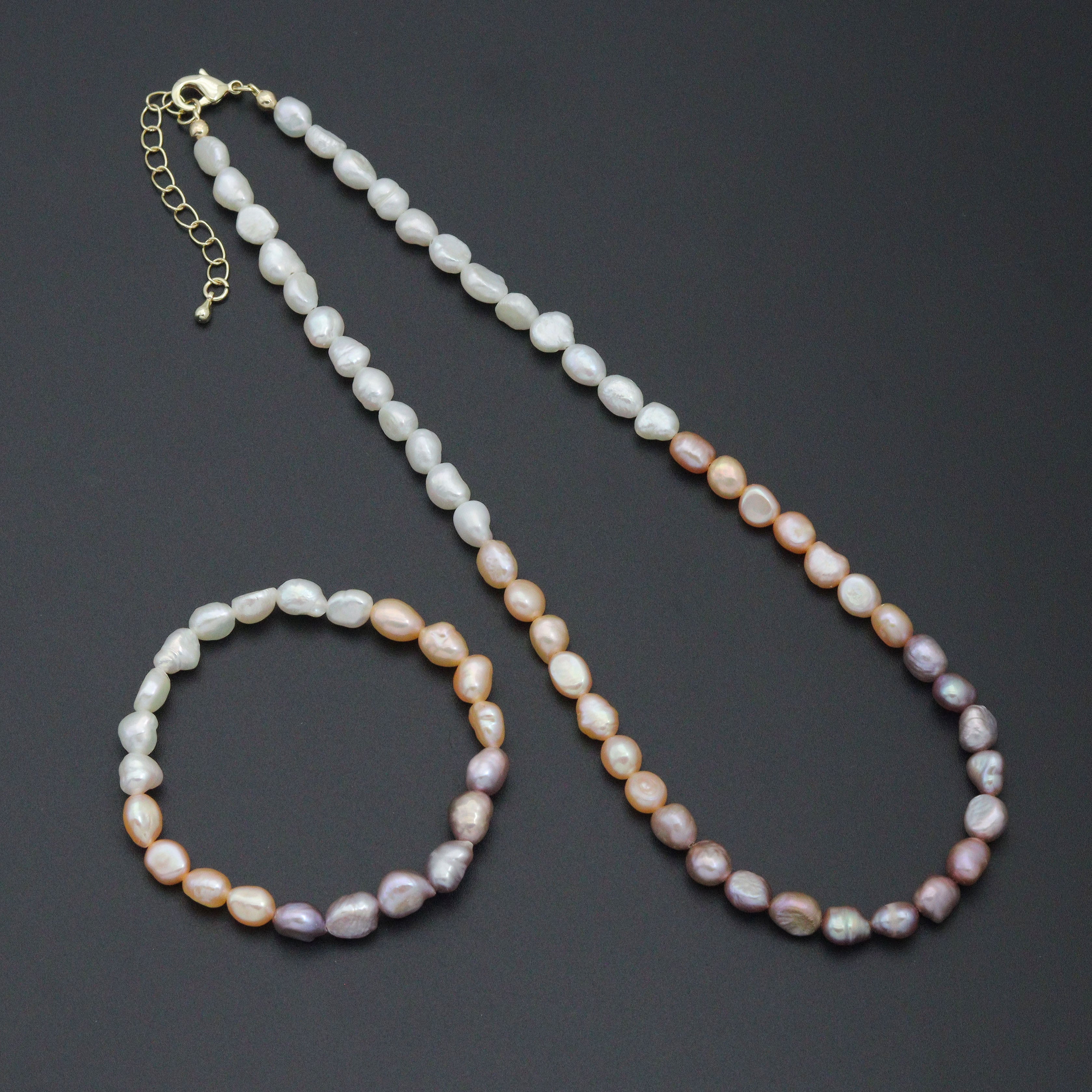 Multicolor freshwater pearl jewelry set featuring a necklace and bracelet by Bestbeads&Beyond with elegant pearl accents.