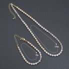 Bestbeads&Beyond ombré pink champagne cube beads jewelry set with matching necklace and bracelet on a display.