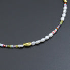 Freshwater pearl and gold spacer bead adjustable necklace by Bestbeads&Beyond, featuring a delicate chain with pearls and gold accents.