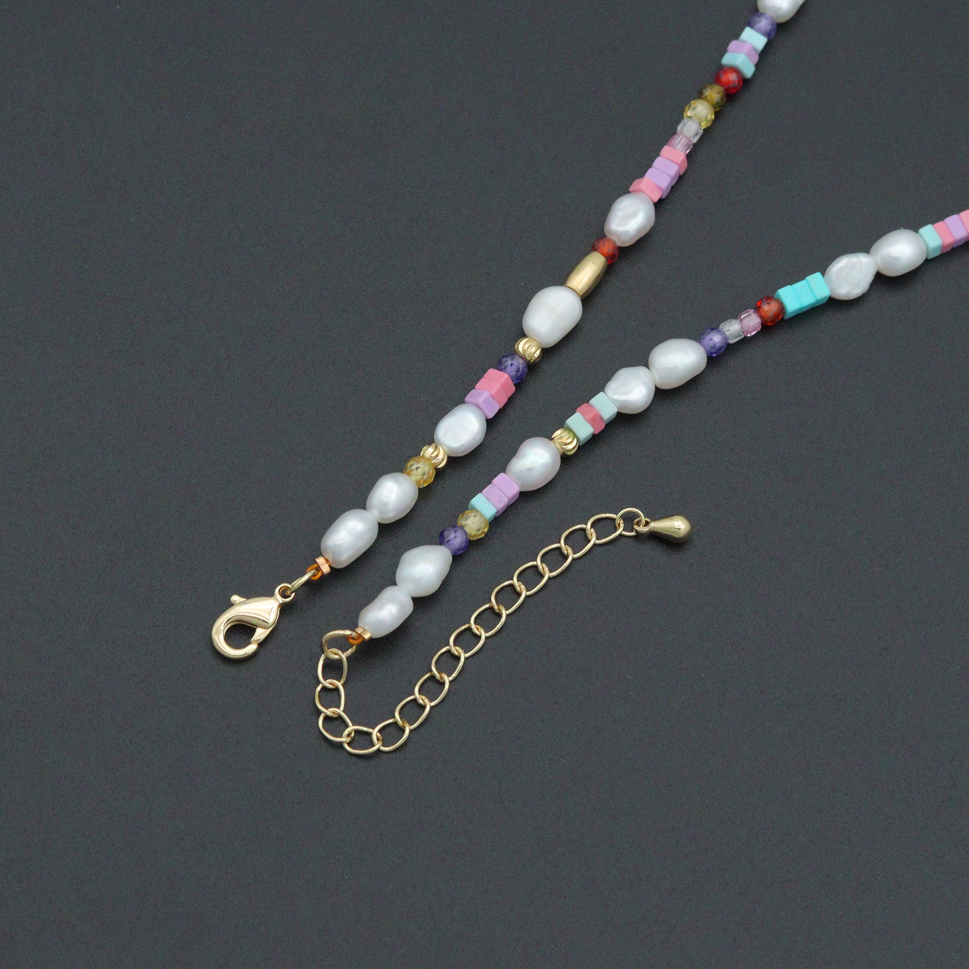 Freshwater pearl and gold spacer beads adjustable necklace by Bestbeads & Beyond, shown with delicate pearl and gold bead details.