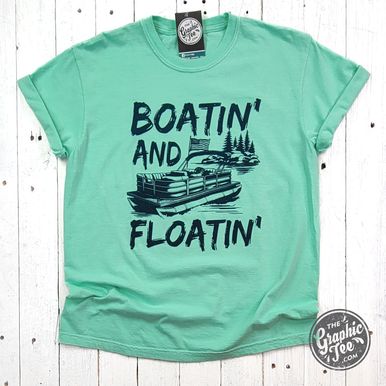 The Graphic Tee Boatin' and Floatin' pigment-dyed short sleeve graphic t-shirt with nautical design on soft fabric.