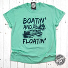 The Graphic Tee Boatin' and Floatin' pigment-dyed short sleeve graphic t-shirt with nautical design on soft fabric.