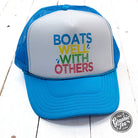 Neon blue and white foam trucker cap with "Boats Well With Others" graphic, casual style, by The Graphic Tee.