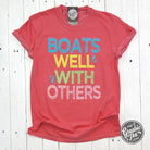 Graphic SS T-shirt by The Graphic Tee featuring "Boats Well With Others" pigment-dyed design on soft fabric.