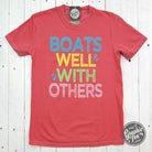 Graphic SS T-shirt by The Graphic Tee featuring "Boats Well With Others" pigment-dyed design on soft cotton fabric.