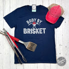 Adult SS Graphic Tee from The Graphic Tee featuring "Body By Brisket" design on soft cotton fabric.