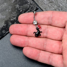 Clear gem butterfly and black cat dangle belly ring from BodyCandy, featuring a decorative hanging design for pierced navel.