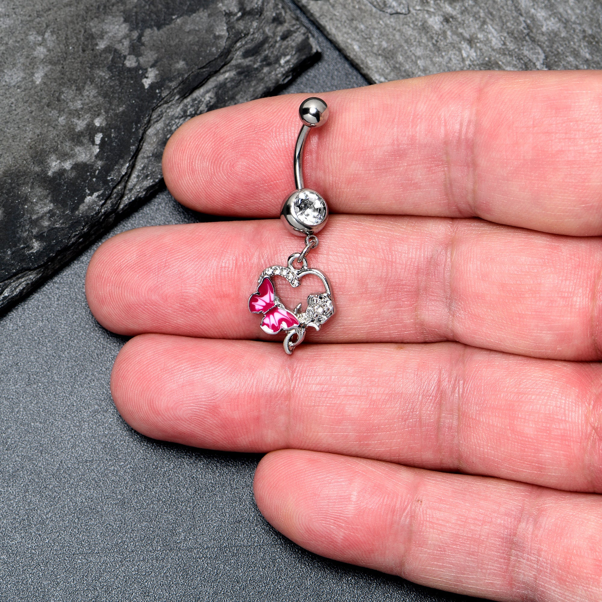 Pink dangle belly ring with clear gem butterfly and rose flower design, body jewelry from BodyCandy.