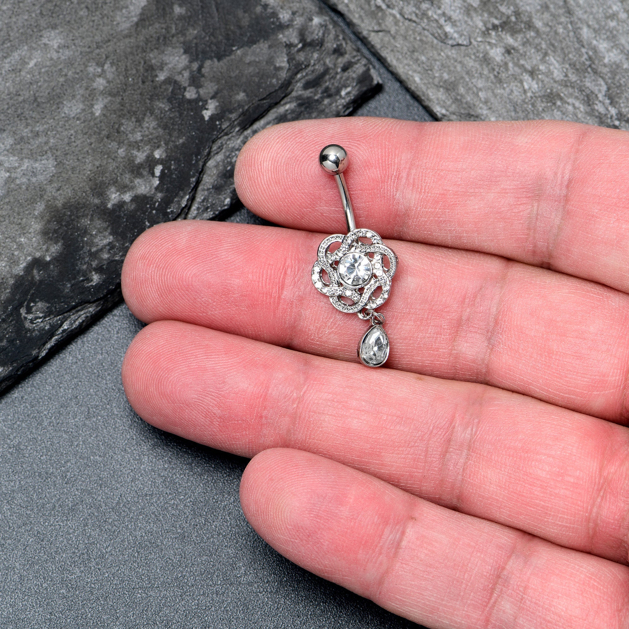 Clear gem Celtic knot dangle belly ring by BodyCandy, featuring an elegant design and dangling style for pierced belly jewelry.
