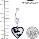 Glow-in-the-dark Flying Bat Heart Belly Ring dangle jewelry by Onyx O, featuring a dark bat and heart design for body piercings.
