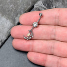 White clear gem constellation moon dangle belly ring by BodyCandy with a silver-tone design and sparkling gemstone accents.