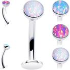 Aqua synthetic opal bezel titanium threadless floating belly ring with top mount, showcasing a sleek, modern design.
