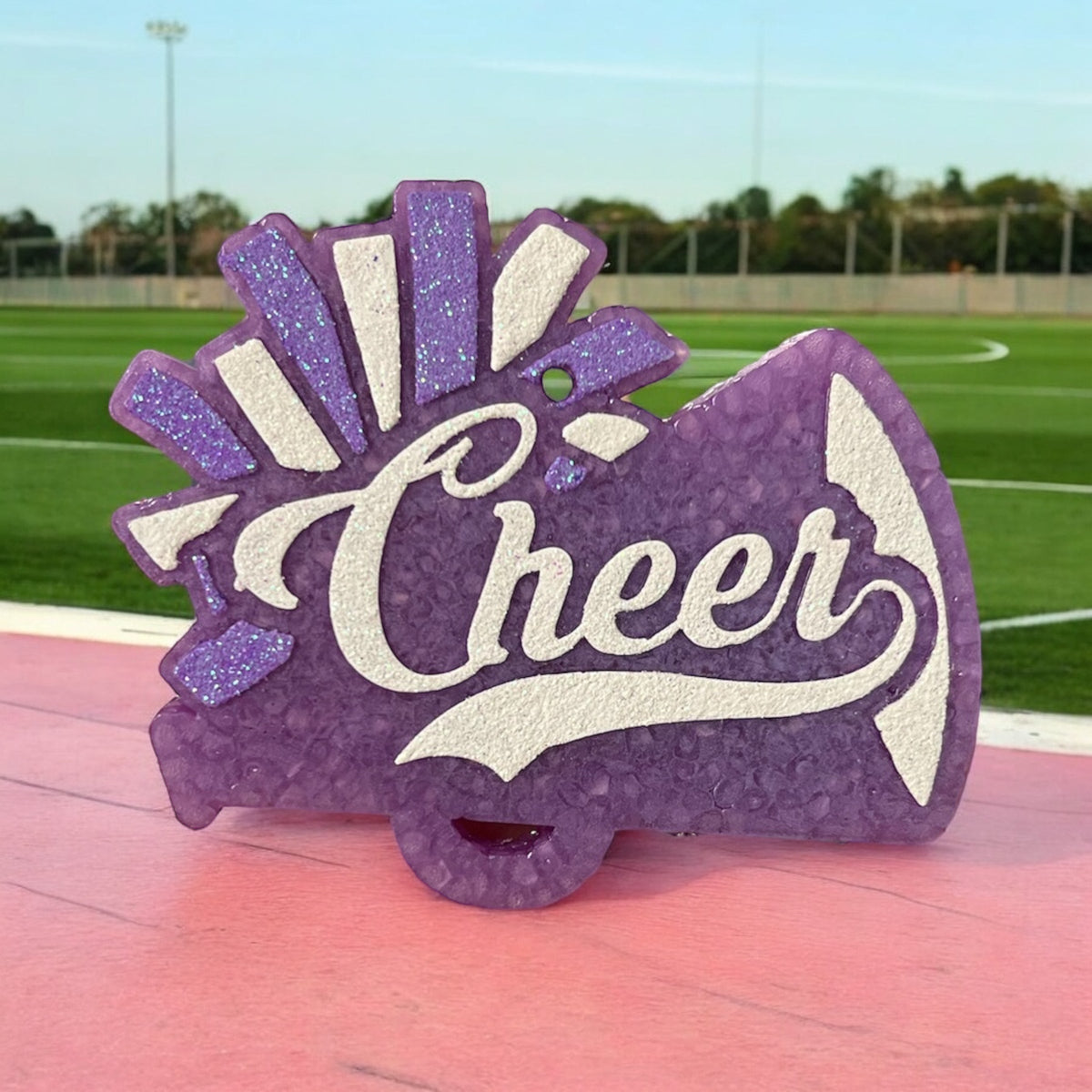 Purple Cheer Freshie air freshener by Bug & Bean Freshies, showing a cheerful cartoon character in a purple design.