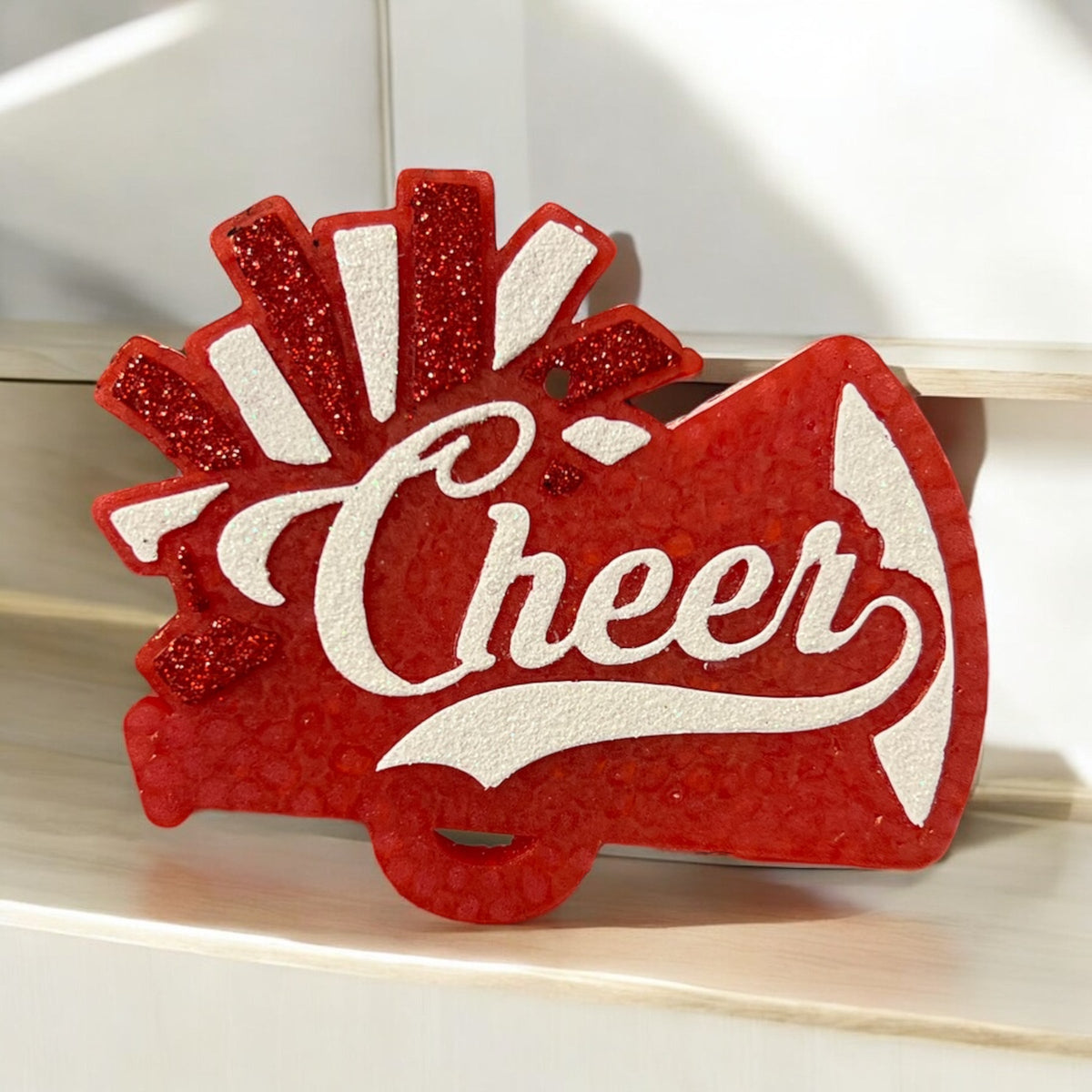Red Cheer Freshie air freshener by Bug & Bean Freshies showing the cheerful mascot and vibrant red design.