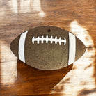 Football Freshie air freshener from Bug & Bean Freshies hanging with football design and vibrant colors.