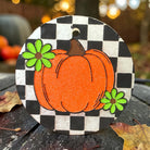 Checkered Pumpkin Freshie air freshener by Bug & Bean Freshies with a decorative checkered pumpkin design.