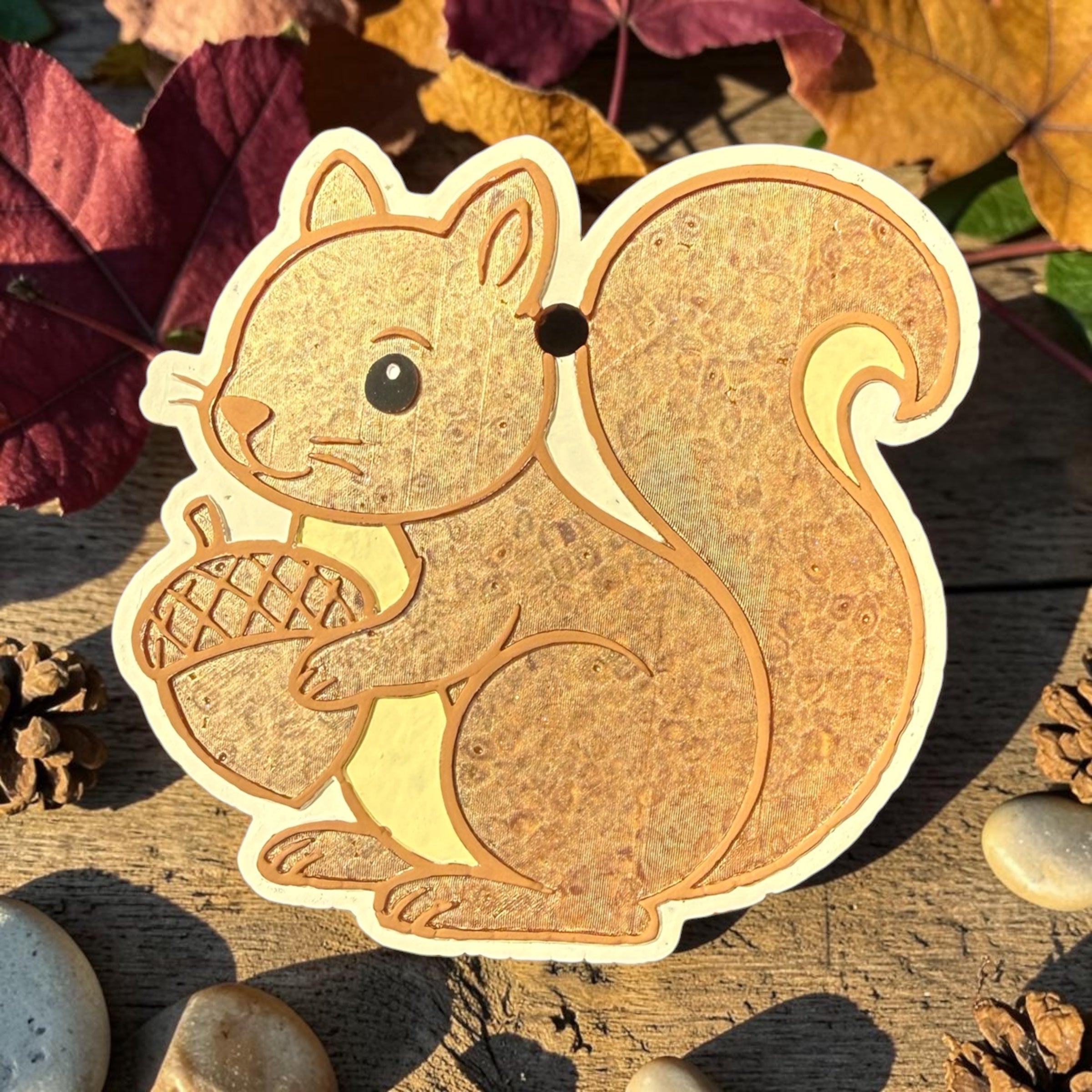 Fall Squirrel Freshie from Bug & Bean Freshies hanging on a door knob, showcasing a cute squirrel-shaped air freshener.