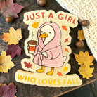 Scented "Just A Girl" Bug & Bean Freshies air freshener in a clear jar with a pink label, designed to freshen up spaces.