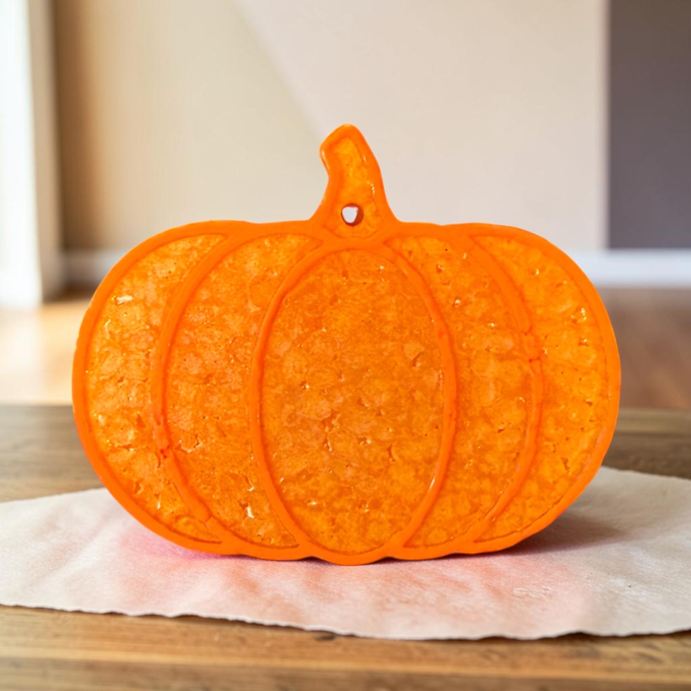 Medium Pumpkin Freshie by Bug & Bean Freshies, a scented air freshener in a pumpkin shape with vibrant orange color.