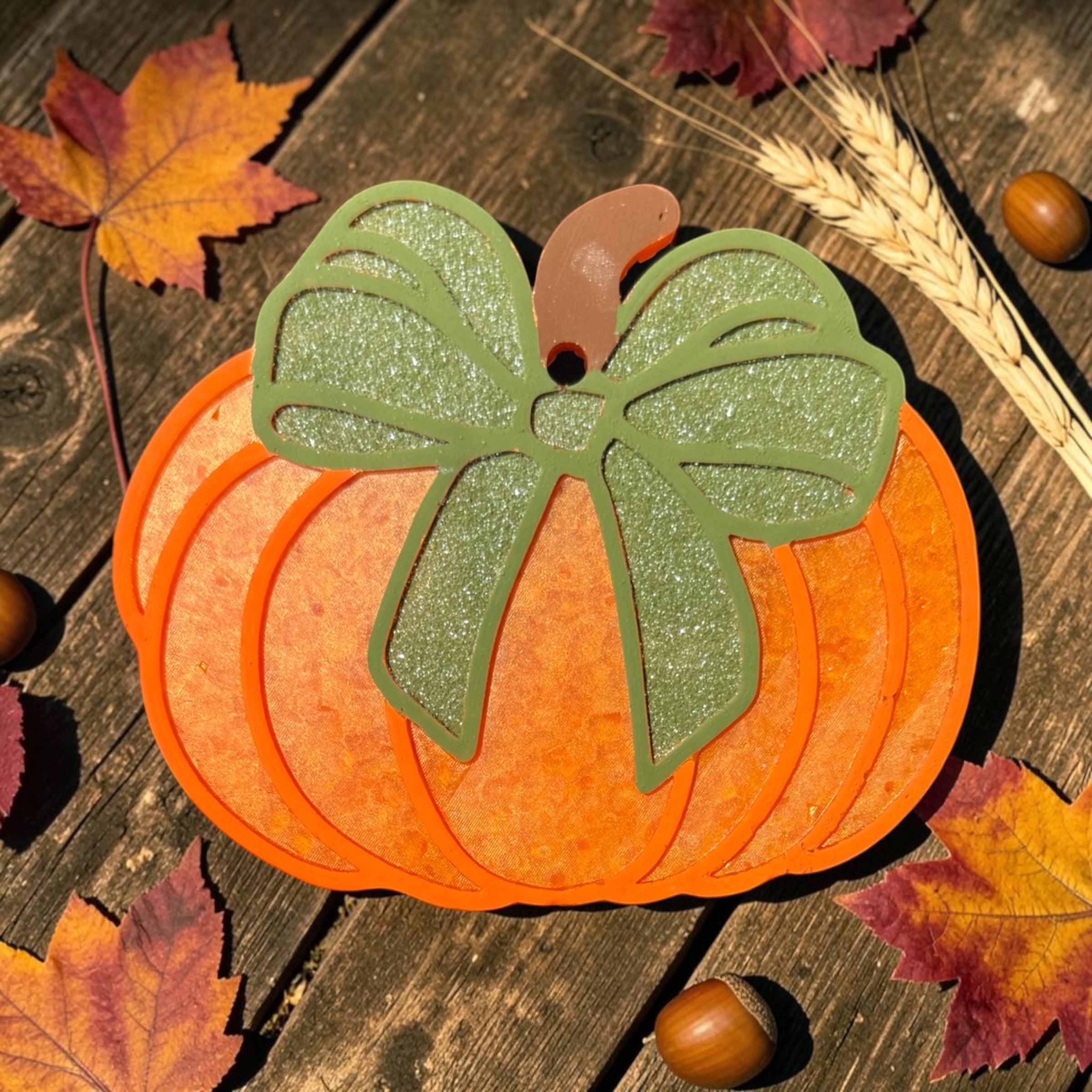 Freshie scented pumpkin-shaped air freshener by Bug & Bean Freshies, showcasing a realistic pumpkin design.