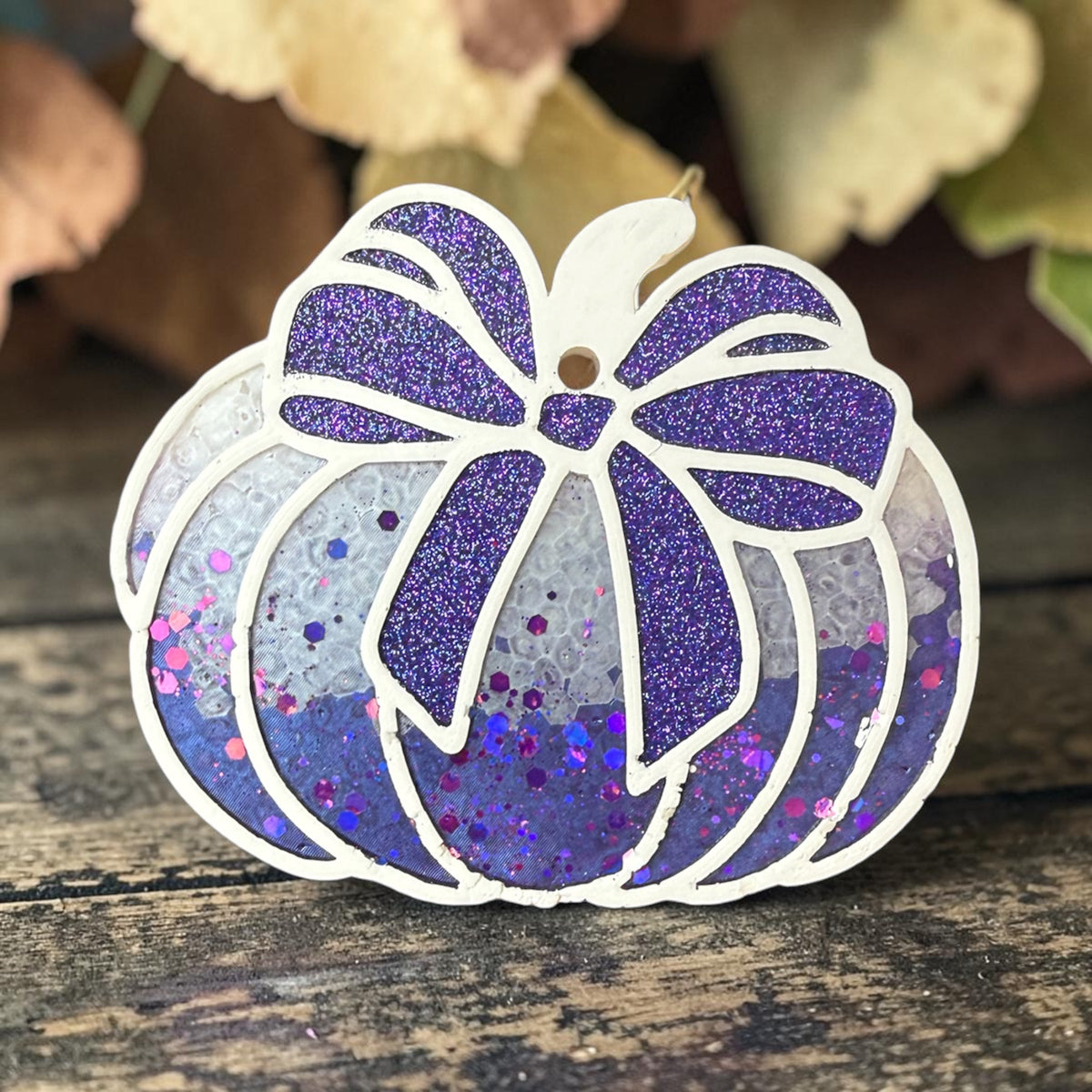 Purple Sparkle Pumpkin Freshie by Bug & Bean Freshies, with a glittery pumpkin shape and vibrant purple color.