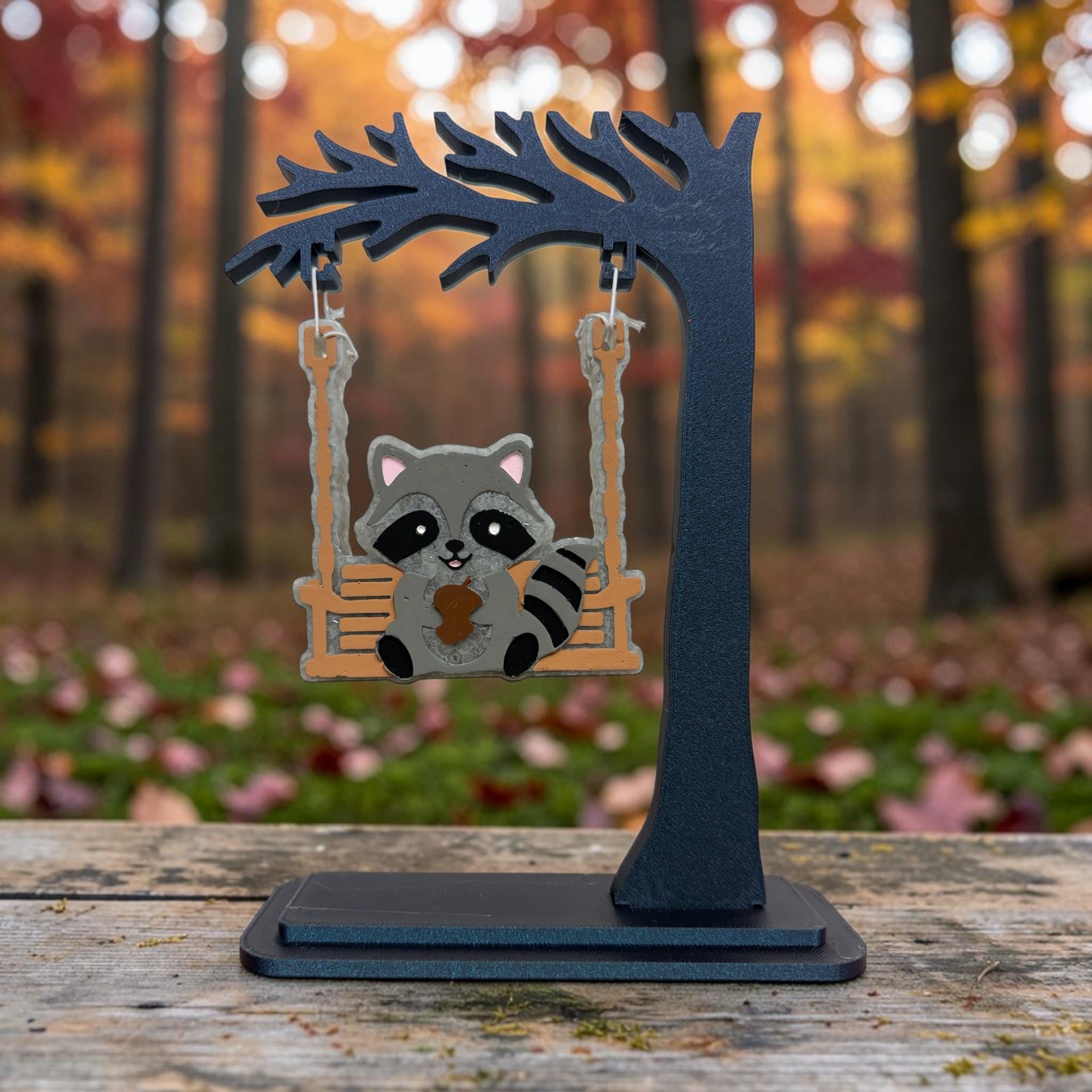 Swinging raccoon Freshie air freshener from Bug & Bean Freshies hanging with a cute raccoon figure.