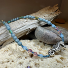 Beachy Seahorse ankle bracelet by Celtic Crystal Design Jewelry featuring green and pink seahorse charms on a delicate bracelet.