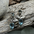 Celtic Morning Blue Topaz Dangle Earrings featuring Celtic crystal design with sparkling blue topaz gemstones.