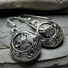 Celtic Wolf Spirit Dangle Earrings by Celtic Crystal Design Jewelry, featuring intricate Celtic wolf motifs in silver-tone metal.