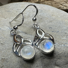 Edana Celtic Moonstone Dangle Earrings by Celtic Crystal Design Jewelry featuring Celtic-inspired silver settings and luminous moonstone stones.