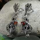 Celtic Crystal Design Jewelry Rhapsody music note dangle earrings featuring silver-tone musical note charms.