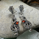 Celtic Crystal Design Jewelry Rhapsody Music Note Dangle Earrings with intricate metalwork and musical note charms.