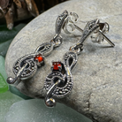 Celtic Crystal Design Jewelry Rhapsody music note dangle earrings with intricate detailing for a stylish look.