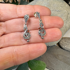 Celtic Crystal Design Jewelry Rhapsody music note dangle earrings with intricate silver-tone musical note charms.