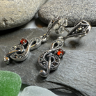 Celtic Crystal Design Jewelry Rhapsody music note dangle earrings featuring intricate silver-tone musical note charms.