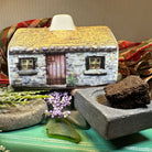 Scottish Cottage Turf Incense Burner from Celtic Crystal Design Jewelry, featuring a detailed miniature cottage for decorative gift use.