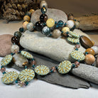 Celtic Crystal Design Jewelry Autumn Morning Long Necklace featuring intricate crystal details and a delicate pendant.