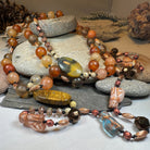 Copper Autumn Cat Long Necklet by Celtic Crystal Design Jewelry featuring a detailed autumn-themed cat pendant.